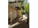 Side view showing a walkway around the house and desert landscaping at 4760 Woodridge Rd, Las Vegas, NV 89121