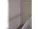 Upstairs hallway featuring white banister and wall and door to a room at 4760 Woodridge Rd, Las Vegas, NV 89121