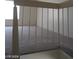 Second story landing with carpeted floors and a view to the window at 4760 Woodridge Rd, Las Vegas, NV 89121