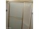 Bathroom shower with sliding glass doors and integrated seat at 4760 Woodridge Rd, Las Vegas, NV 89121