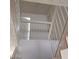 View looking up a staircase with white railing and textured walls at 4760 Woodridge Rd, Las Vegas, NV 89121