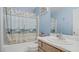 Charming bathroom with a tub-shower combo, seashell-themed decor, and a white vanity at 482 Painted Sage Ct, Henderson, NV 89015