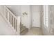 Entryway with staircase, decor, and a window with blinds; showing a bright, neutral color scheme at 482 Painted Sage Ct, Henderson, NV 89015