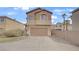 Inviting two-story home with a front-facing garage and traditional design elements under a sunny sky at 482 Painted Sage Ct, Henderson, NV 89015
