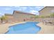 Sparkling backyard pool with lounge chairs; perfect for relaxation at 482 Painted Sage Ct, Henderson, NV 89015