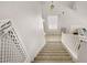 Carpeted staircase leading to the upper level with natural light at 482 Painted Sage Ct, Henderson, NV 89015