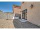 Backyard with low-maintenance landscaping, concrete patio, and sliding door at 4832 Englewood Ave, Las Vegas, NV 89139
