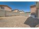 Large, gravel backyard featuring block wall, potential for customization and landscaping at 4832 Englewood Ave, Las Vegas, NV 89139