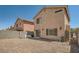 Gravel backyard featuring block wall, lawn space, and access to the house at 4832 Englewood Ave, Las Vegas, NV 89139