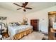 Bedroom featuring a ceiling fan, wood floors, and natural light at 4832 Englewood Ave, Las Vegas, NV 89139