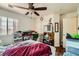 Bedroom featuring natural light, ceiling fan and attached closet at 4832 Englewood Ave, Las Vegas, NV 89139