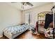 Bedroom with a ceiling fan, natural light from window, and wood laminate floors at 4832 Englewood Ave, Las Vegas, NV 89139