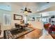 Open dining area with wood floors, a ceiling fan, a decorative rug and mirror at 4832 Englewood Ave, Las Vegas, NV 89139