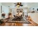 Dining area features wood floors, a ceiling fan, and view of the entryway at 4832 Englewood Ave, Las Vegas, NV 89139