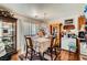 Bright dining area featuring natural light, wood floors, and adjacent kitchen at 4832 Englewood Ave, Las Vegas, NV 89139