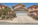 Charming two-story home with well-manicured landscaping and a two-car garage in a suburban neighborhood at 4832 Englewood Ave, Las Vegas, NV 89139