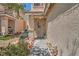 Charming home entrance with desert landscaping and decorative accents at 4832 Englewood Ave, Las Vegas, NV 89139