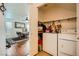 Laundry room with washer, dryer and storage, as well as open access to dining area at 4832 Englewood Ave, Las Vegas, NV 89139