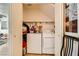 Laundry closet with washer and dryer hookups and utility shelving at 4832 Englewood Ave, Las Vegas, NV 89139