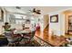 Inviting dining and living area with beautiful wood floors, a ceiling fan, and a staircase at 4832 Englewood Ave, Las Vegas, NV 89139