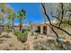 Beautifully landscaped backyard with lush greenery and mature trees at 4845 Santo Romeo St, Las Vegas, NV 89135