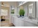 Bright bathroom featuring double vanity sinks and natural light, designed for a spa-like atmosphere at 4845 Santo Romeo St, Las Vegas, NV 89135