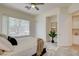 Cozy bedroom with plush carpet and tree views, creating a tranquil and inviting space at 4845 Santo Romeo St, Las Vegas, NV 89135