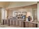 Enjoy the convenience of the communal coffee bar featuring rich wood cabinetry and marble countertops at 4845 Santo Romeo St, Las Vegas, NV 89135