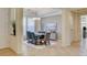 Well-lit dining area with stylish furniture, modern lighting, and tile flooring at 4845 Santo Romeo St, Las Vegas, NV 89135