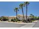 Charming single-story home with a tile roof, palm trees, and a lush landscaped yard at 4845 Santo Romeo St, Las Vegas, NV 89135