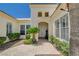 Inviting front entrance with a covered walkway and attractive landscaping at 4845 Santo Romeo St, Las Vegas, NV 89135
