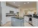 Bright kitchen with an island, granite countertops, stainless appliances and tile backsplash at 4845 Santo Romeo St, Las Vegas, NV 89135