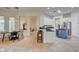 Open kitchen area with a breakfast bar, center island, and stainless steel appliances at 4845 Santo Romeo St, Las Vegas, NV 89135