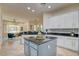 Spacious kitchen showcasing a center island, and open layout to the living area at 4845 Santo Romeo St, Las Vegas, NV 89135