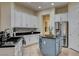 Modern kitchen featuring a center island, stainless steel appliances, and sleek countertops at 4845 Santo Romeo St, Las Vegas, NV 89135