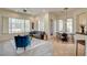 Inviting living room and dining area with a ceiling fan, comfortable seating, and natural light at 4845 Santo Romeo St, Las Vegas, NV 89135