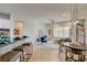 Open concept living space featuring tile floors, modern furniture, and bright natural light at 4845 Santo Romeo St, Las Vegas, NV 89135