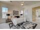 Spacious bedroom with large windows, modern decor, and a walk-in closet entrance at 4845 Santo Romeo St, Las Vegas, NV 89135