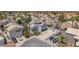 Aerial view of the home in a neighborhood with palm trees, solar panels, and ample parking at 4871 La Princesa Ct, North Las Vegas, NV 89031