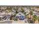 Beautiful aerial view of a home with solar panels, green lawn, and mature landscaping at 4871 La Princesa Ct, North Las Vegas, NV 89031