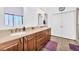 Bathroom featuring double sink vanity and walk-in shower at 4871 La Princesa Ct, North Las Vegas, NV 89031