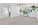Inviting bedroom with natural light, ceiling fan and stylish hanging plants at 4871 La Princesa Ct, North Las Vegas, NV 89031