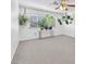 Well-lit bedroom with natural light and stylish hanging plants at 4871 La Princesa Ct, North Las Vegas, NV 89031