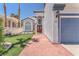 Charming home with a well-maintained lawn, walkway, and manicured landscaping leading to the front door at 4871 La Princesa Ct, North Las Vegas, NV 89031