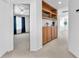 Bright hallway with built-in shelves and view into a bedroom at 4871 La Princesa Ct, North Las Vegas, NV 89031