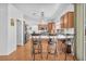 Charming kitchen features wood cabinets, stainless steel appliances, and an island with seating at 4871 La Princesa Ct, North Las Vegas, NV 89031