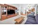 Spacious living room with an entertainment center flows into the kitchen at 4871 La Princesa Ct, North Las Vegas, NV 89031