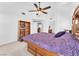 Comfortable main bedroom with ceiling fan and built in shelves at 4871 La Princesa Ct, North Las Vegas, NV 89031