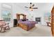 Spacious main bedroom with fireplace and ceiling fan at 4871 La Princesa Ct, North Las Vegas, NV 89031