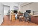 Functional office features two desks, wood-look floors, and natural light at 4871 La Princesa Ct, North Las Vegas, NV 89031
